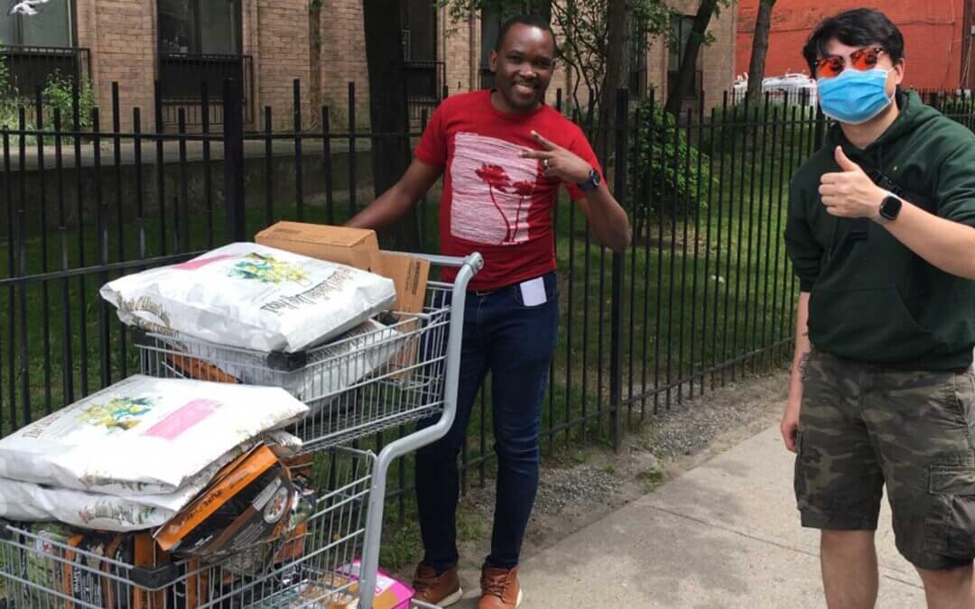 A photo of two Humane World Foundation Canada workers delivering pet food