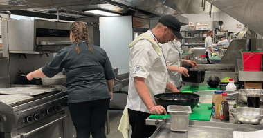 Photo of people cooking in Western Universities kitchen