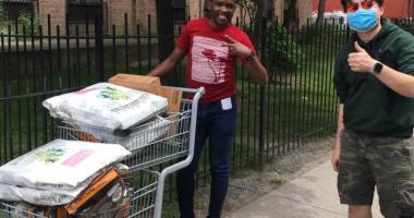 A photo of two Humane World Foundation Canada workers delivering pet food